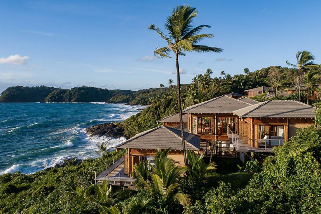 Brazilian coastal residence surrounded by palms